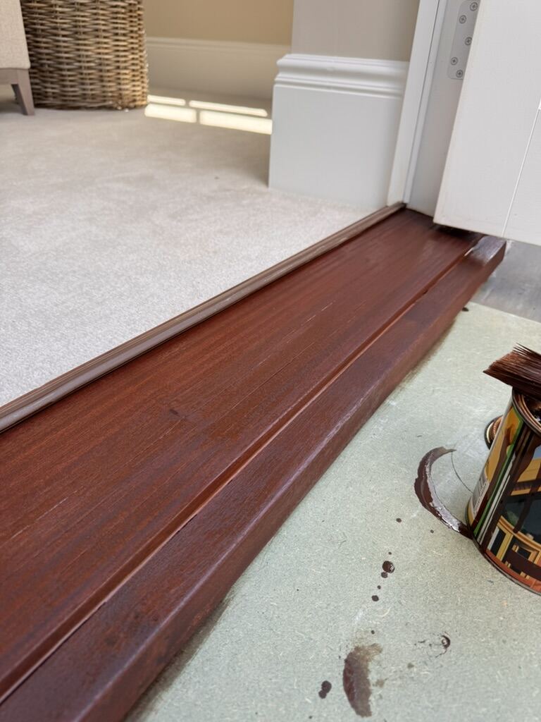 Freshly refinished mahogany skirting board and architrave